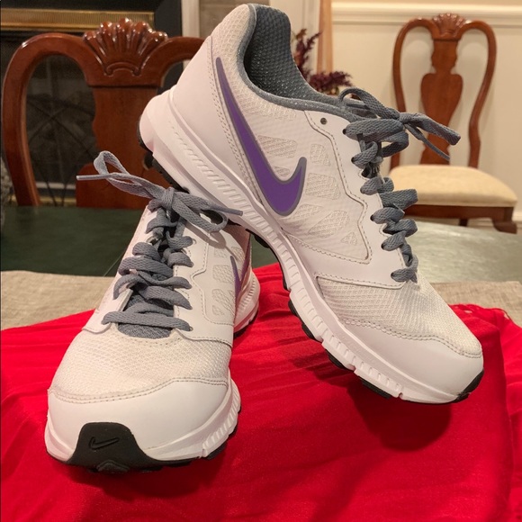 white nike shoes with purple swoosh
